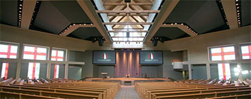 Here’s a photo you can use, too, plus a caption: Our Savior's Church (Lafayette, LA) — To accommodate its rapidly growing congregation, the church sought a new 1,100-seat expandable worship center to serve as the permanent campus in Lafayette. The new facility needed to have a high level of audio, video and lighting systems to support the dynamic praise and worship. Idibri worked with the church and design team to incorporate the acoustical recommendations and technical systems into the architecture. This involved special attention to the unique architectural features, particularly the ceiling which included a center pop-up with windows and an eye-brow over the platform. Accommodations were provided for future expansion into a dedicated video production room when they decide to include camera systems for Image Magnification or broadcast to a satellite venue. (Photo courtesy of Idibri.com)