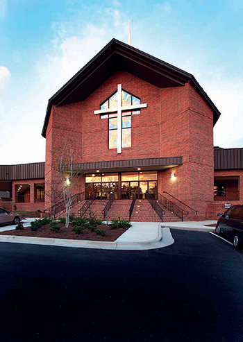 At Beacon Baptist Church in Raleigh, NC, a cost-efficient metal building clad with brick offers a dramatic visual exterior. The striking and attractive entry helps build the church’s image as a progressive and dynamic community. Inside, its column-free structure allows excellent site lines and abundant sanctuary seating.